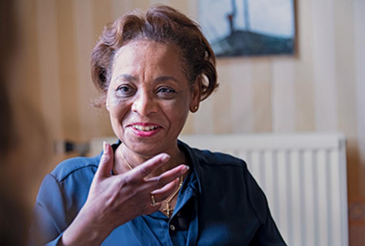 Woman smiling and gesturing